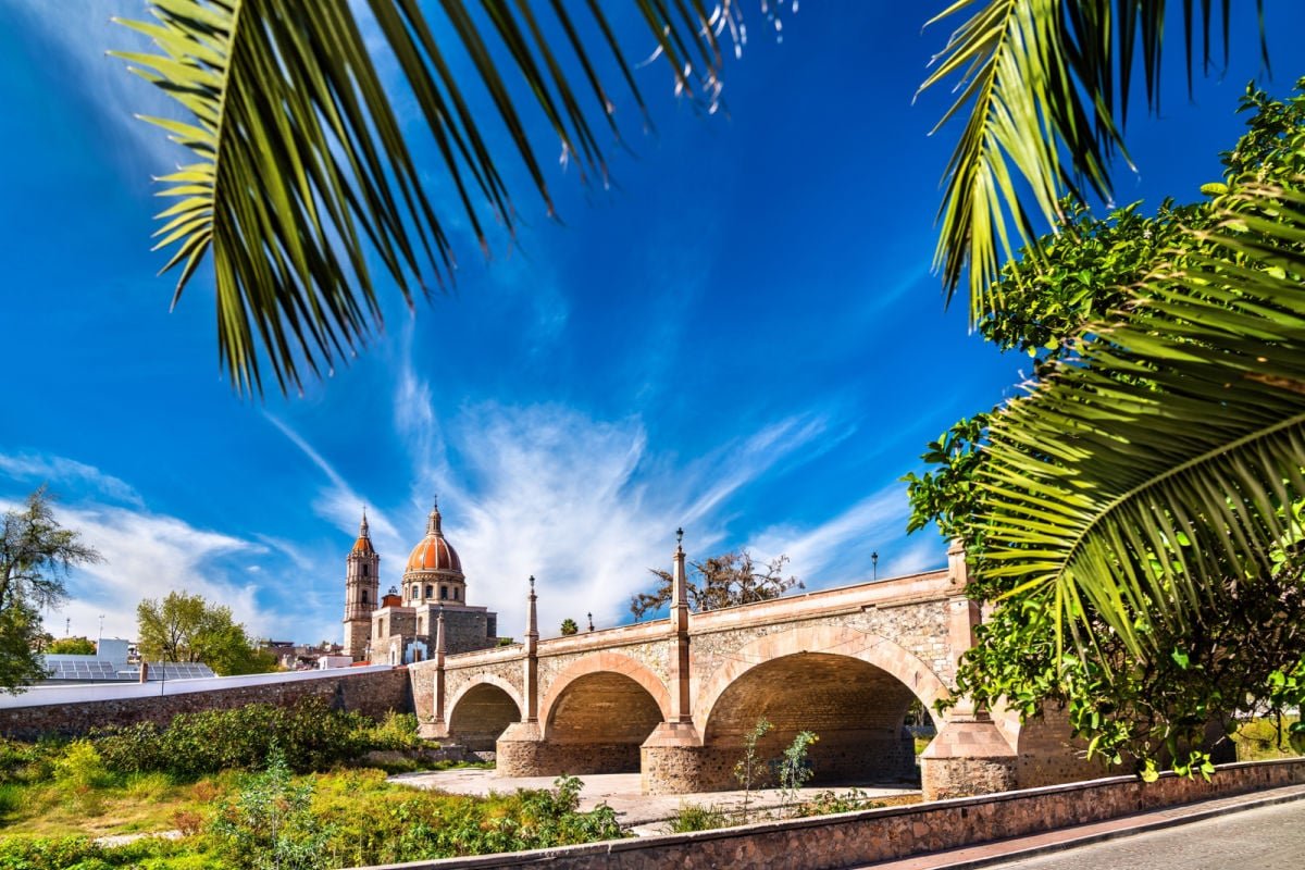 Old colonial bridge and Parish of the Light in Lagos de Moreno